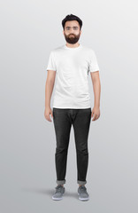 Fototapeta premium Standing Male model wearing white plain crew neck t shirt in dark grey denim pant. Isolated background.
