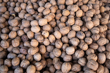 Walnuts with shell background, texture. Top view