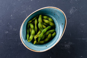Green beans are the unripe fruit common bean (Phaseolus vulgaris), green string bean dish top view
