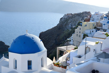 Fototapeta premium Blue and white church and Aegean Sea on Santorini island, Greece