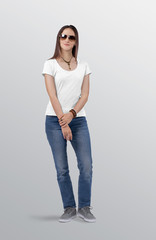 Female model wearing white plain t shirt in blue denim jeans pant.