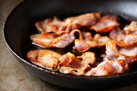 close up of rustic pan fried english back bacon