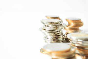 Coins stacked on each other in different positions. Saving money and account finance bank business concept. Business Finance and Money concept,Save money for prepare in the future.time is money concep