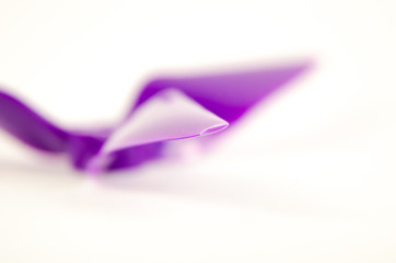 Closeup of quadcopter or drone propeler for freestyle or racing drone. 5051 3 blade propellers in purple taken in high key with bokeh effect
