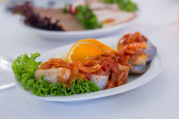 Kashubian-style herring. Herring with onion with tomatos souce.