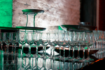 Luxury catering. Wedding or anniversary. Banquet. table served with flowers and glasses for wine or champagne.