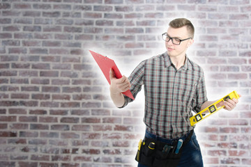 Engineer. Young attractive guy and tools.