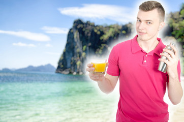 Attractive barman pours a cocktail. Sea and vacation.