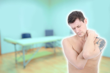 Health problems. The man has a sore shoulder.