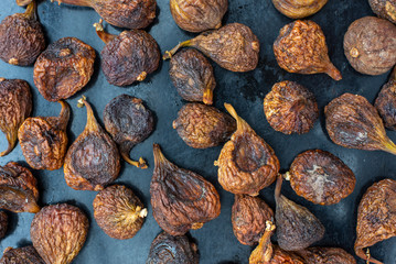 Organic dried figs close up, vegetarian food background
