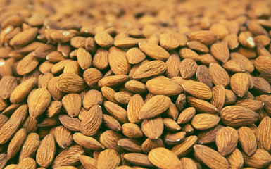 Peeled almond nuts at the market close up. Selective focus. Healthy food concept background