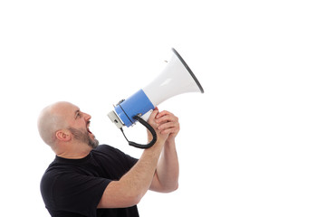 Portrait of angry man shouting with a megaphone. Bearded man yelling into a megaphone, isolated. Copy space for your text