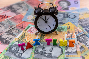 Australian dollars with clock and 'tax time' text