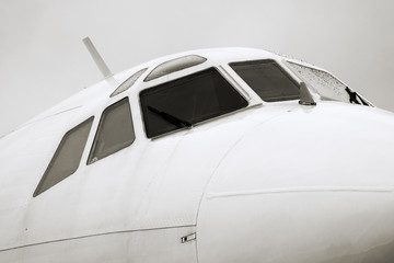 Tupolev Tu-154M nose closeup in rainy day, monochrome image