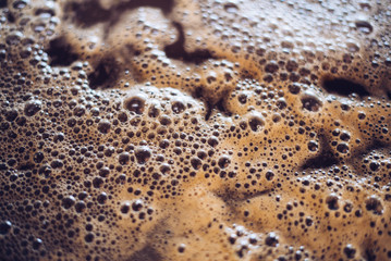 Bubbles the wort white wine during fermentation, closeup, background