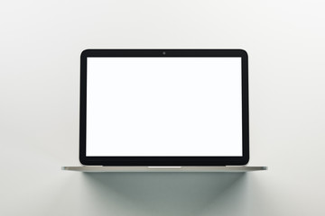 Monochrome concept with blank white mock up screen of modern laptop.