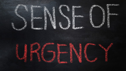 handwriting sense of urgency  on chalkboard
