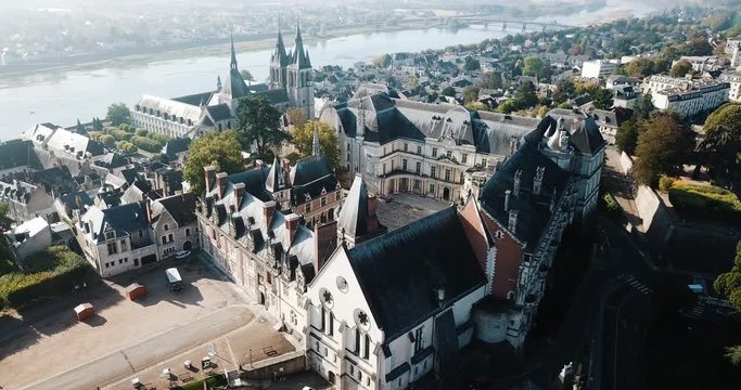 BLOIS, FRANCE - OCTOBER 09, 2018: View from drone of impressive Royal Chateau de Blois on background with cityscape in sunny autumn day, France