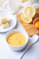 Homemade Hollandaise Sauce. Classic traditional sauce based on eggs. Basic sauce of French cuisine. Selective focus, close-up.
