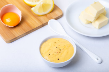Homemade Hollandaise Sauce. Classic traditional sauce based on eggs. Basic sauce of French cuisine. Selective focus, close-up.