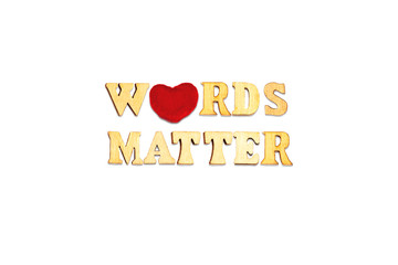 words matter phrase composed with wooden letters isolated  on white background with red heart symbol