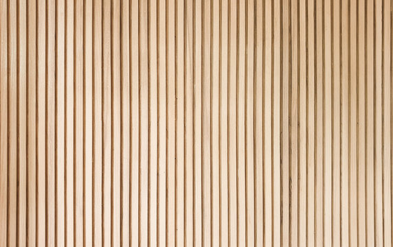 solid wooden battens wall pattern background with natural color finishing