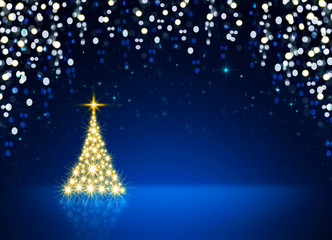 Golden Christmas tree isolated on blue sky background.