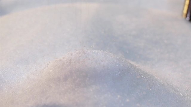 Polypropylene granules closeup slowmotion, polypropylene drop. Plastic granules fall in slow motion