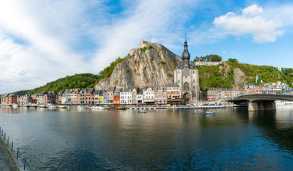 Naklejka premium horizontal view of the Meuse River and the historic old riverside town of Dinant in Belgium