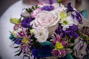 flower arrangement in silver bowl with pink and white roses