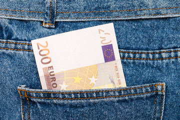 Euro banknotes in jeans back pocket. Forgotten money, nest egg. Concept of saving or spending...