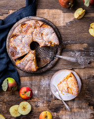 Apple pie on a wooden background. Fragrant autumn baking.