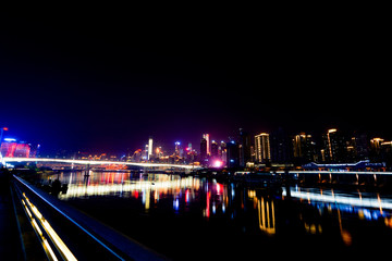 Fototapeta na wymiar Night Scenery of High-rise Buildings of Chongqing River-Crossing Bridge in Asia