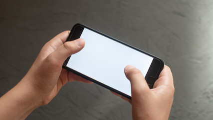a man holding a mobile phone