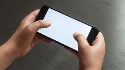 a man holding a mobile phone