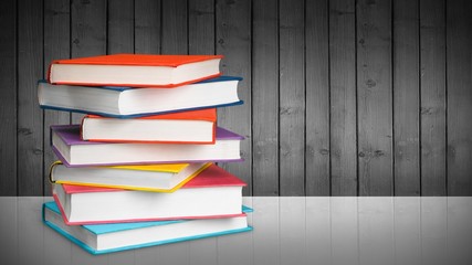 Colorful books collection on background.
