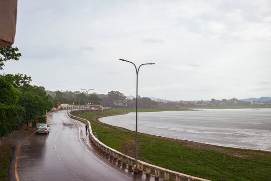 Wet roads across fateh sagar lake in Udaipur RAJASTHAN India , famous tourist attraction 