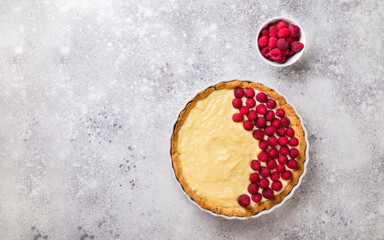 Cooking the cake with custard and raspberries. Berry baking. Summer tart.