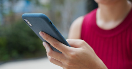 Woman use of mobile phone in city