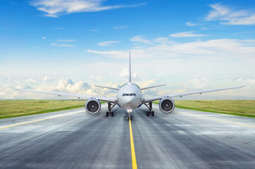 Taxiing passenger commercial airplane to the runway.