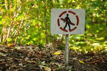A person sign is prohibited. Pointer prohibiting passage in the forest. Prohibition sign in the park.