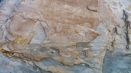 Colourful stone/rock texture close up.  Image taken of a feature rock at Herrington Country Park in Sunderland.