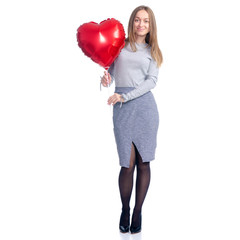 Valentine beautiful woman with red balloon shape heart in hand standing smiling on white background isolation