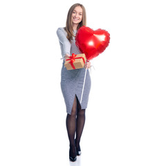 Valentine beautiful woman with red balloon shape heart and gift box in hand standing smiling on white background isolation