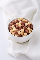 Breakfast cereals in a bowl viewed from above. Top view