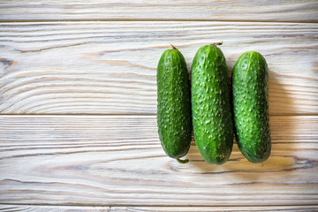Fresh organic cucumber on the wooden table