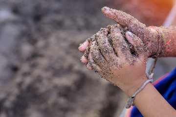 Dirty hands of children,child to the playing with mud