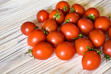 Cherry tomatoes. Tomatoes on a branch. Background of tomatoes. Vegetables and fruits. Healthy eating