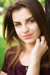 Attractive young woman enjoying her time outside in the park.