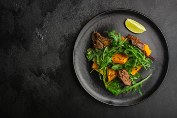 healthy salad with liver (tasty appetizer) menu concept. food background. copy space. Top view
